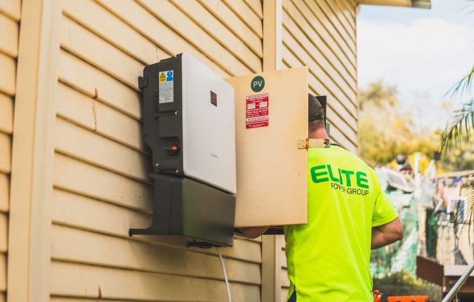 HX-series hybrid inverter installed on a garage wall